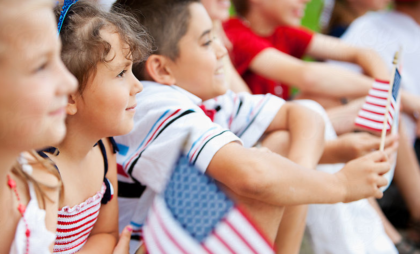 Young Girl Waves American Flag